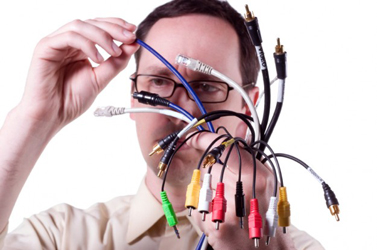 man with handful computer cable