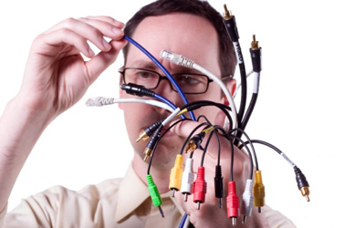 man with handful computer cable man with handful computer cable